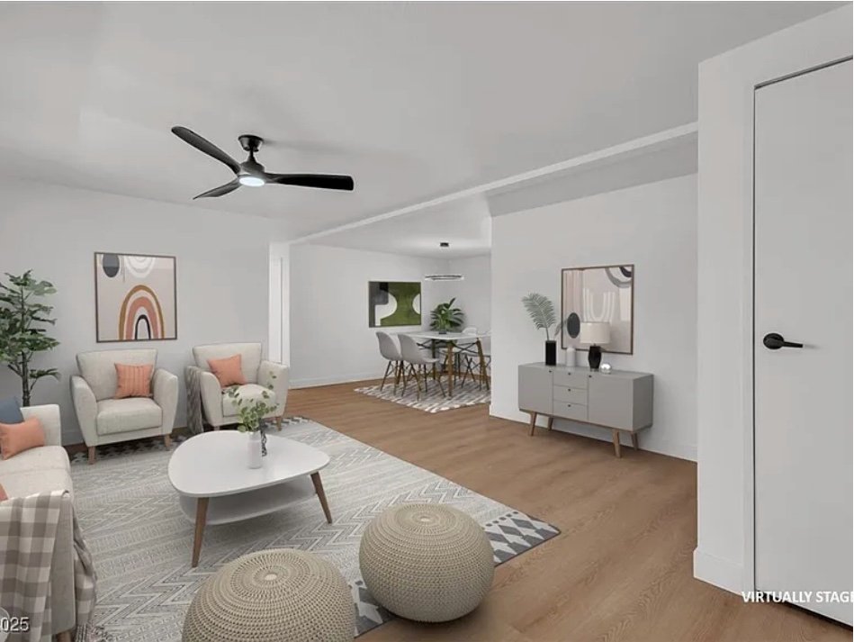 Contemporary living room featuring a sofa, coffee table, and decorative elements in a neutral color palette.